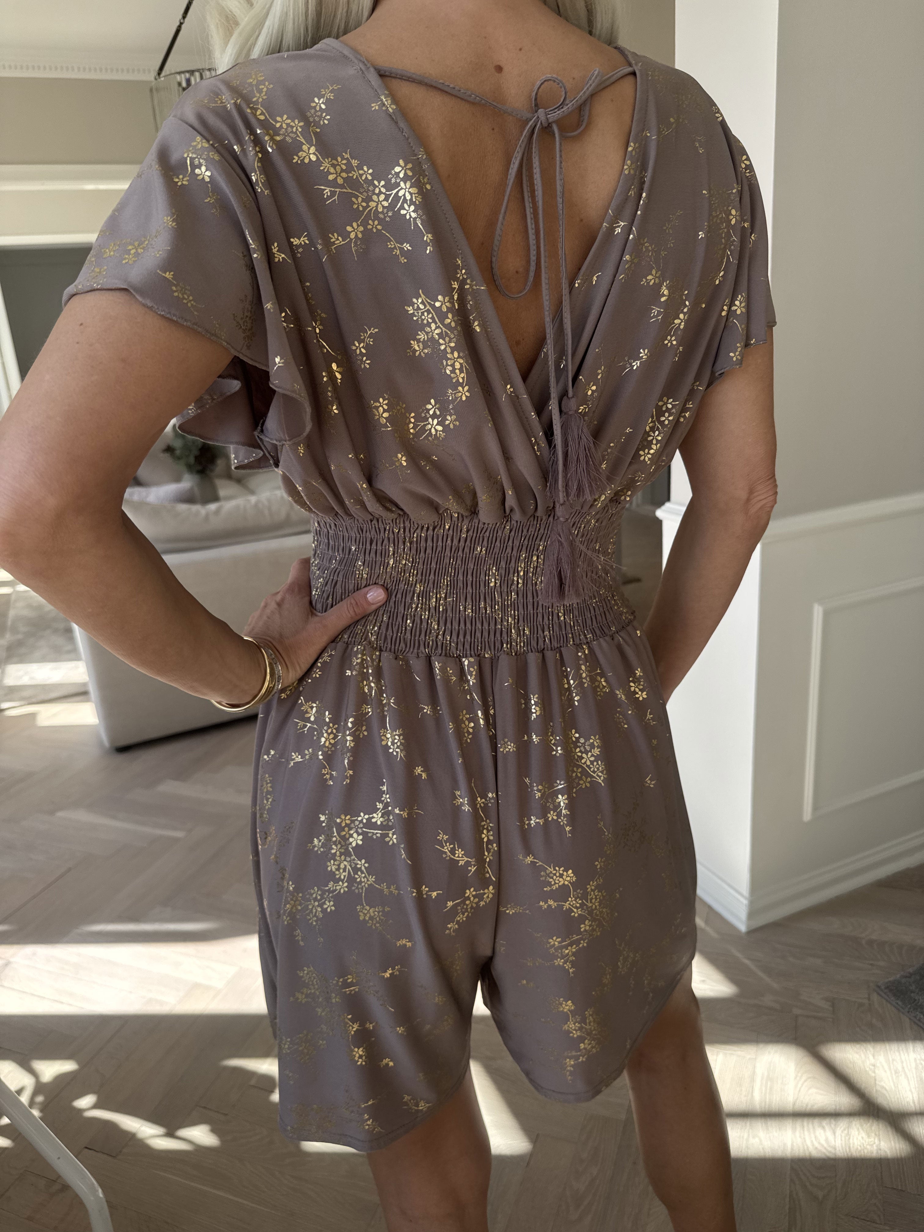 Pams Gold Playsuit - Jumpsuit med resår och guldtryck